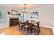 Elegant dining room with fireplace, natural light, and hardwood floors at 702 Windmill Pl, Highlands Ranch, CO 80126
