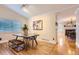 Formal dining room area with a view of the living room and fireplace at 702 Windmill Pl, Highlands Ranch, CO 80126