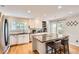 Bright kitchen featuring granite countertops and barstool seating at 702 Windmill Pl, Highlands Ranch, CO 80126