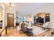 Bright living room with wood floors, vaulted ceiling, built-in shelving and comfortable furniture at 702 Windmill Pl, Highlands Ranch, CO 80126