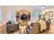 Inviting living room with built-in shelving and neutral decor at 702 Windmill Pl, Highlands Ranch, CO 80126