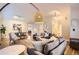 Open-concept living room and dining area with stylish decor at 702 Windmill Pl, Highlands Ranch, CO 80126