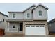 Charming two-story home featuring a modern elevation and two-car garage at 3352 N Buchanan Way, Aurora, CO 80019