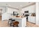 Spacious kitchen with island seating, stainless steel appliances, and ample cabinetry at 3352 N Buchanan Way, Aurora, CO 80019