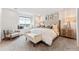 Main bedroom features a large window seat, neutral tones, and a king bed at 3352 N Buchanan Way, Aurora, CO 80019