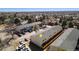 This is an aerial view of the apartment complex, showing the parking lot and surrounding buildings at 8915 Field St # 113, Westminster, CO 80021