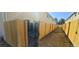 Fenced backyard with grass and a gate for easy access, providing privacy and space at 8915 Field St # 113, Westminster, CO 80021