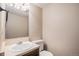 A clean, functional bathroom with a vanity, mirror, and a toilet in a neutral color scheme at 8915 Field St # 113, Westminster, CO 80021