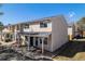 Inviting exterior of a tan-colored townhome featuring a covered porch and well-maintained landscaping at 8915 Field St # 113, Westminster, CO 80021