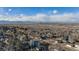 This aerial view shows the Denver neighborhood with mountain views at 5086 N Raleigh St, Denver, CO 80212