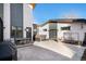 Modern backyard with concrete patio, hot tub, dining set, and sleek architectural design at 5086 N Raleigh St, Denver, CO 80212