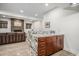 Finished basement with stylish bar area featuring granite countertops and a cozy fireplace at 5086 N Raleigh St, Denver, CO 80212