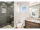 Contemporary bathroom with a glass-enclosed shower, elegant vanity, and modern finishes at 5086 N Raleigh St, Denver, CO 80212