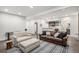 Spacious living room offering ample seating, modern decor, and an open layout into a kitchenette at 5086 N Raleigh St, Denver, CO 80212