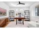 Modern home office with hardwood floors, white walls, natural light and sophisticated decor at 5086 N Raleigh St, Denver, CO 80212