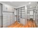 Organized walk-in closet with custom shelving, drawers, and ample storage space for clothes and accessories at 5086 N Raleigh St, Denver, CO 80212