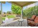 Backyard featuring a covered patio with outdoor seating and a well maintained yard at 859 Equinox Dr, Erie, CO 80516