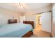 Bedroom with king bed, a barn door and carpet at 859 Equinox Dr, Erie, CO 80516
