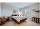 Comfortable bedroom with bright light and carpet floors at 859 Equinox Dr, Erie, CO 80516