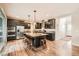 Modern kitchen boasts a large island, stainless steel appliances, and ample counter space at 859 Equinox Dr, Erie, CO 80516