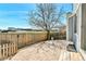 Fenced backyard with brick pavers and a large shade tree at 8050 Bryant St, Westminster, CO 80031
