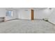 Basement area features neutral walls, neutral carpet, and a small window for natural light at 8050 Bryant St, Westminster, CO 80031