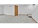 Finished basement with plush carpeting, door, and neutral paint at 8050 Bryant St, Westminster, CO 80031