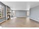 Open living room with wood-look tile floors, a fireplace, and ample natural light at 8050 Bryant St, Westminster, CO 80031