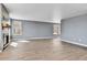 Bright living room features wood-look tile floors, a fireplace, and lots of natural light at 8050 Bryant St, Westminster, CO 80031