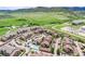 Expansive aerial view of the community with lush green landscape and mountain views at 10056 W Unser Dr # 106, Littleton, CO 80127