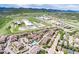 Aerial view of the community with a pool and mountain views at 10056 W Unser Dr # 106, Littleton, CO 80127