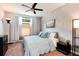 Inviting bedroom with a ceiling fan, soft natural light, and stylish furnishings at 10056 W Unser Dr # 106, Littleton, CO 80127