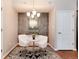 Cozy dining area features a modern chandelier, stylish furniture, and elegant décor at 10056 W Unser Dr # 106, Littleton, CO 80127