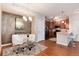 Bright dining area adjacent to the kitchen features a modern chandelier and elegant décor at 10056 W Unser Dr # 106, Littleton, CO 80127
