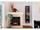 Inviting fireplace with decorative accents, adding warmth and charm to the living space at 10056 W Unser Dr # 106, Littleton, CO 80127