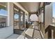Inviting balcony with comfortable seating, offering views of the surrounding neighborhood and natural light at 2363 S Lupine Way, Denver, CO 80228