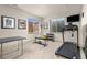 Basement gym featuring a treadmill, weight rack, and ping pong table at 2363 S Lupine Way, Denver, CO 80228