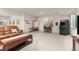 Spacious finished basement with a shuffleboard table, ski lift chair, arcade game, and seating area at 2363 S Lupine Way, Denver, CO 80228