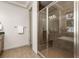 Bathroom with tiled shower and glass doors at 2363 S Lupine Way, Denver, CO 80228