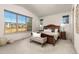 Cozy bedroom featuring a large window, providing plenty of natural light at 2363 S Lupine Way, Denver, CO 80228