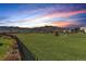 Community green space with mountain views at sunset at 2363 S Lupine Way, Denver, CO 80228