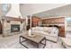 Cozy living room with a stone fireplace at 2363 S Lupine Way, Denver, CO 80228