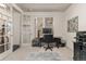 Well-lit home office featuring french doors, neutral carpet, and a work desk at 2363 S Lupine Way, Denver, CO 80228