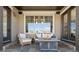 Cozy outdoor patio with comfortable seating and a modern fire pit table at 2363 S Lupine Way, Denver, CO 80228