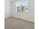 Bright bedroom with large window providing natural light at 6840 Merseyside Ln, Castle Pines, CO 80108