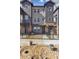 Townhome front elevation with decorative landscaping at 6840 Merseyside Ln, Castle Pines, CO 80108