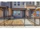 Townhome entrance with decorative stone landscaping at 6840 Merseyside Ln, Castle Pines, CO 80108