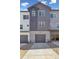 New construction home with two-car garage and a concrete driveway at 6840 Merseyside Ln, Castle Pines, CO 80108