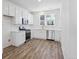 Stylish kitchen featuring stainless appliances and white cabinets at 6840 Merseyside Ln, Castle Pines, CO 80108