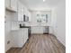 Modern kitchen features stainless appliances and white cabinets at 6840 Merseyside Ln, Castle Pines, CO 80108